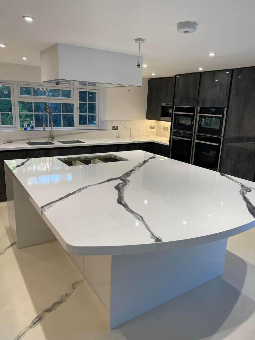 Modern kitchen renovation with dark metallic epoxy floor